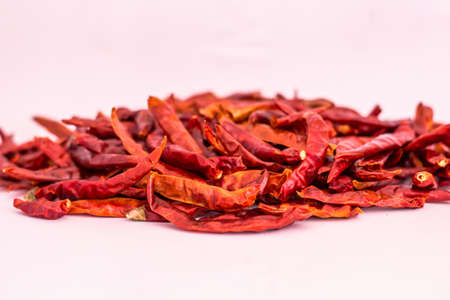 Dried red chili or chilli cayenne pepper isolated on white backgroundの写真素材