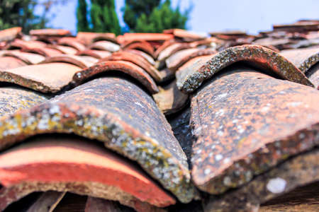 Close up of old red tile roofs
