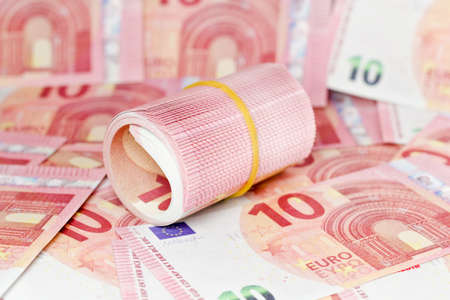 rolled 10 euro with euro background