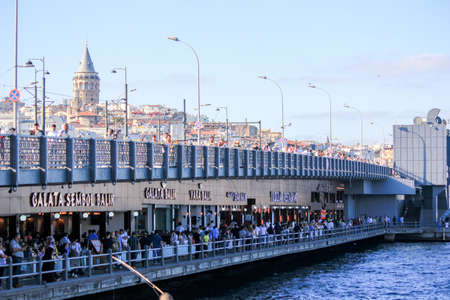 Fisherman fishing on the Galata Bridge in Istanbul Turkeyのeditorial素材