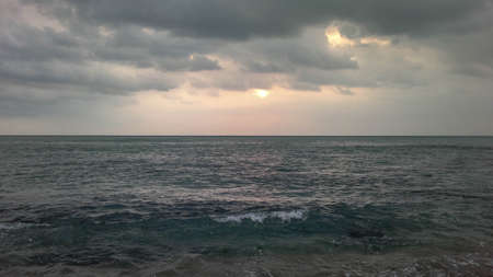 Cloudy sky and sea wave