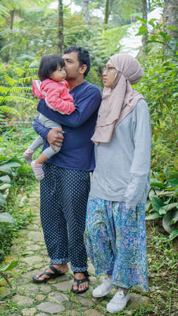 BOGOR, INDONESIA - 16 December 2018 : Full length Portrait Muslim family happy smilingのeditorial素材