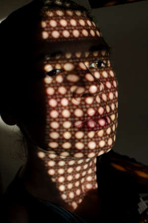 Shot of young woman at confession in little church.の写真素材