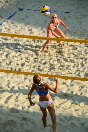 ZELL AM SEE, AUSTRIA - JUNE 26: Participants at the Beach City 2010 center court, the biggest amateur Beach Volleyball Tournament in Austria. June 26, 2010 in Zell am See, Austriaのeditorial素材