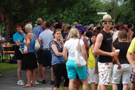 MITTERSILL, AUSTRIA - JUL 4: People and supporters at the Water fun Event called Erdinger Sautrogrennen on July 4, 2010 at the Zierteich in Mittersill, Austriaのeditorial素材