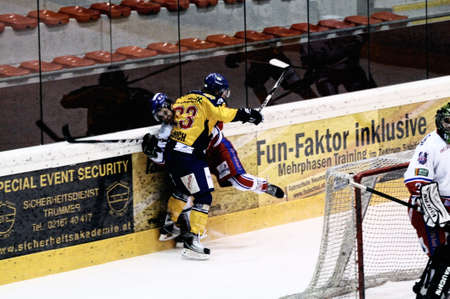 ZELL AM SEE, AUSTRIA - FEB 1: Austrian National League. Phillipp Ullrich hits Graz player. Game EK Zell am See vs. ATSE Graz (Result 4-1) on February 1, 2011, at hockey rink of Zell am Seeのeditorial素材