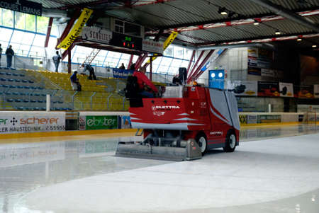 ZELL AM SEE, AUSTRIA - APRIL 30: Hockey world tournament. Bantam major final Black wings Linz (Austria) vs. Sokol-96 Kiev (Ukraine). Zamboni cleaning ice after the second period in the hockey rink of Zell am See, Austria in April 30, 2011.のeditorial素材