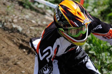 LEOGANG, AUSTRIA - JUN 12: UCI Mountain bike world cup. Samuel Blenkinsop (NZL)  the downhill final race on June 12, 2011 in Leogang, Austria.のeditorial素材