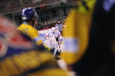 ZELL AM SEE; AUSTRIA - NOV 6: Austrian National League. The goalie of Dab. Docler Dunaujvaros is focused on the puck. Game EK Zell am See vs Dab. Docler Dunaujvaros (Result 2-3) on November 6, 2011.のeditorial素材