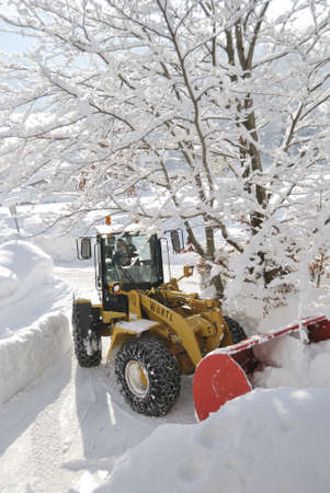 INNSBRUCK; AUSTRIA - JAN 8: Snow removal vehicle removing snow after blizzard in Tirol, Austria...