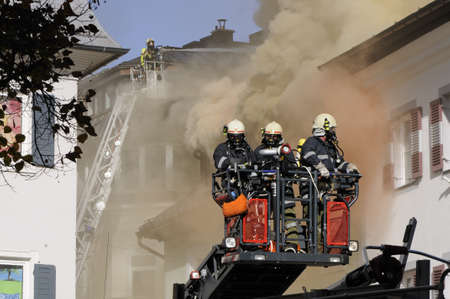 ZELL AM SEE; AUSTRIA - OCT 31: Firefighters attempt to extinguish a big fire in the centre of Zell...