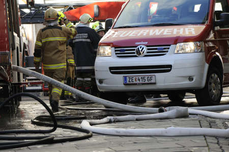 ZELL AM SEE; AUSTRIA - OCT 31: Firefighters attempt to extinguish a big fire in the centre of Zell...