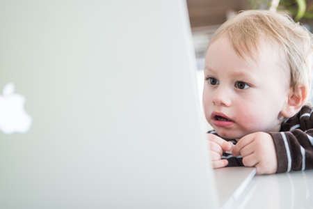 Two years old Boy Lorenz, symbolic for the computer generation.のeditorial素材