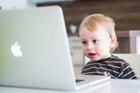 Two years old Boy Lorenz, symbolic for the computer generation.のeditorial素材