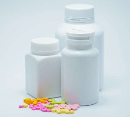 Capsule pills with bottles on white backgroundの写真素材