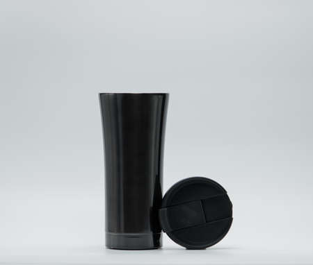 Modern thermos bottle with opened lid isolated on white backgroundの写真素材