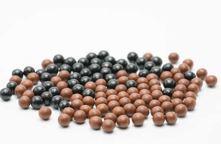 Thai herbal medicine pills spread on white background, bolusの写真素材