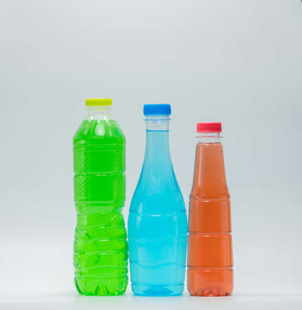 Three modern design bottles of soft drink on white backgroundの写真素材