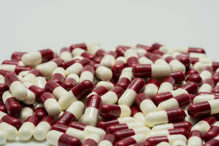 Two tone antibiotic capsule pills on white background, drug resistanceの写真素材