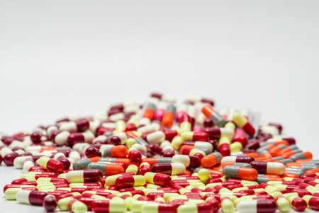 Colorful of antibiotic capsules pills on white background, drug resistanceの写真素材