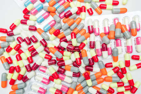 Colorful of antibiotic capsules pills on white background, drug resistanceの写真素材