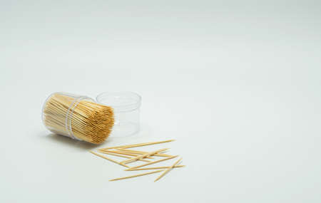 Toothpicks in a clear plastic bottle. And some fell on the floor,Toothpick slant, Toothpick splatterの写真素材