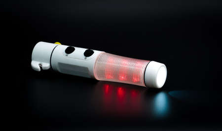 Car safety emergency hammer broken windows rescue equipment, emergency hand torch isolated on black background with copy spaceの写真素材