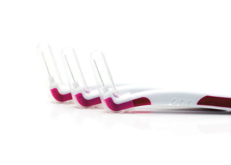 Three interdental brush with cover isolated on white background with copy space