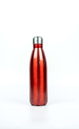 Red thermos bottle with sport design isolated on white background with copy spaceの写真素材