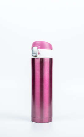 Pink thermos bottle isolated on white background with copy spaceの写真素材