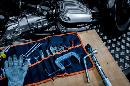 CHONBURI, THAILAND- SEPTEMBER 10, 2017 :Tool set on the table with black and white scene single cylinder head cover in BMW motorcycle shopのeditorial素材