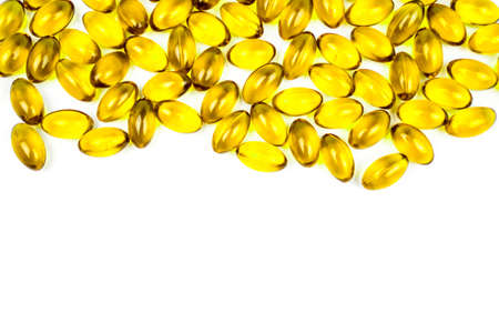 Fish oil in soft gelatin capsule isolated on white background with copy space for text. Vitamin and supplement for health protection and promotion concept.の写真素材
