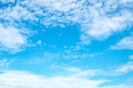 Beautiful blue sky with clouds on sunshine day with copy space for textの写真素材