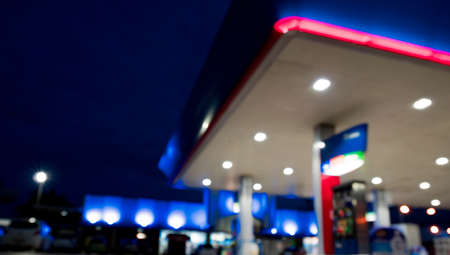 Lighting blurred in gas station at nightの写真素材
