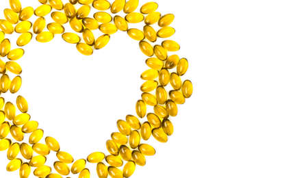 Heart shaped of cod liver oil isolated on white background with copy space. Source of Omega-3 (DHA+EPA) and vitamin A & D helps growth development and absorption of calcium and phosphorous in the bodyの写真素材