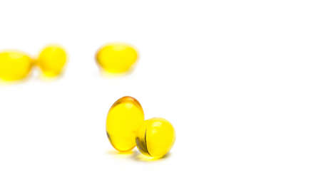Pile of cod liver oil isolated on white background. Source of Omega-3 and vitamin A & D helps growth development and absorption of calcium and phosphorous in the bodyの写真素材