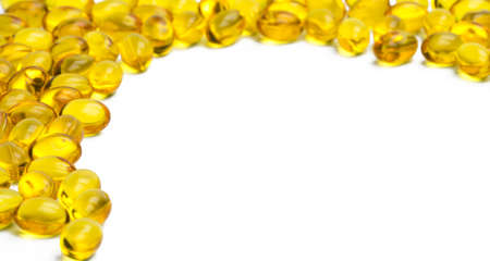 Pile of cod liver oil isolated on white background. Source of Omega-3 and vitamin A & D helps growth development and absorption of calcium and phosphorous in the bodyの写真素材