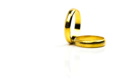 Two gold wedding ring isolated on white background with copy space, just add your own text