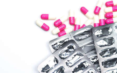 Pile of used blister pack and capsule pills on white background with copy spaceの写真素材
