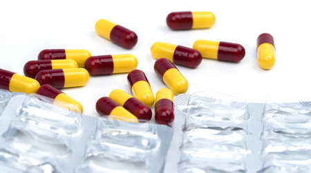 Pile of used blister pack and capsule pills on white background with copy spaceの写真素材