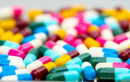 Selective focus of antibiotic capsules pills on blur background, drug resistance concept.の写真素材