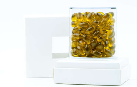 Rice bran oil extract capsule in luxury plastic box packaging isolated on white backgroundの写真素材