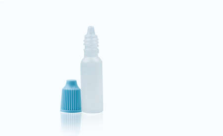 Eye drops bottle with opened blue cap isolated on white background with blank label and copy space, just add your own text.の写真素材