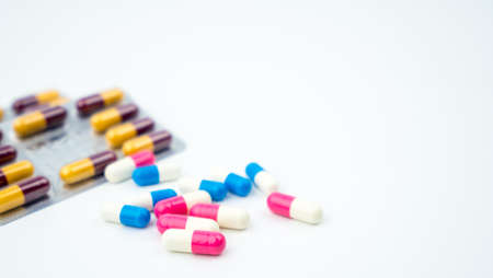Colorful of antibiotic capsules pills on blurred background with copy space. Drug resistance,...