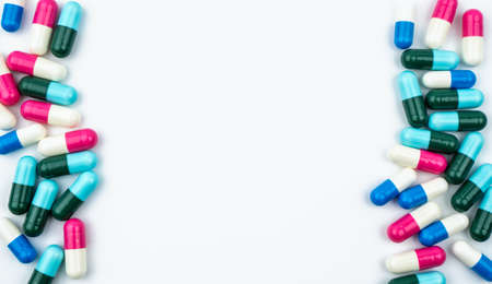 Colorful of antibiotic capsules pills isolated on white background with copy space. Drug resistance, antibiotic drug use with reasonable, health policy and health insurance concept.の写真素材