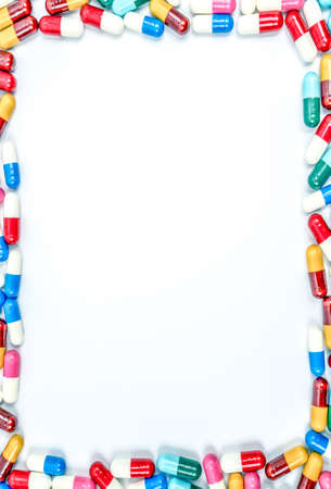 Colorful of antibiotics capsule pills on white background with copy space. Drug resistance concept. Antibiotics drug use with reasonable and global healthcare concept.の写真素材
