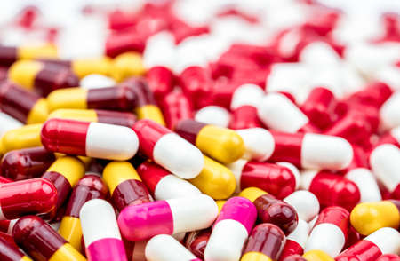 Selective focus on colorful of antibiotic capsules pills on blur background with copy space. Drug resistance concept. Antibiotics drug use with reasonable and global healthcare concept.の写真素材