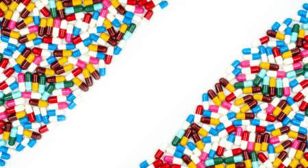 Colorful of antibiotic capsules pills on white background with beautiful pattern and copy space. Drug resistance concept. Antibiotics drug use with reasonable and global healthcare concept.の写真素材
