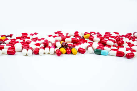 Selective focus of antibiotic capsules pills on white background. Drug resistance concept. Antibiotics drug use with reasonable and global healthcare concept.の写真素材