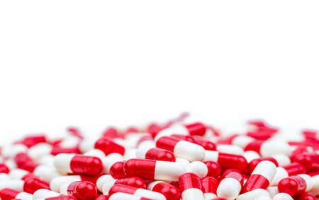 Selective focus of antibiotic capsules pills on white background with copy space. Drug resistance concept. Antibiotics drug use with reasonable and global healthcare concept.の写真素材
